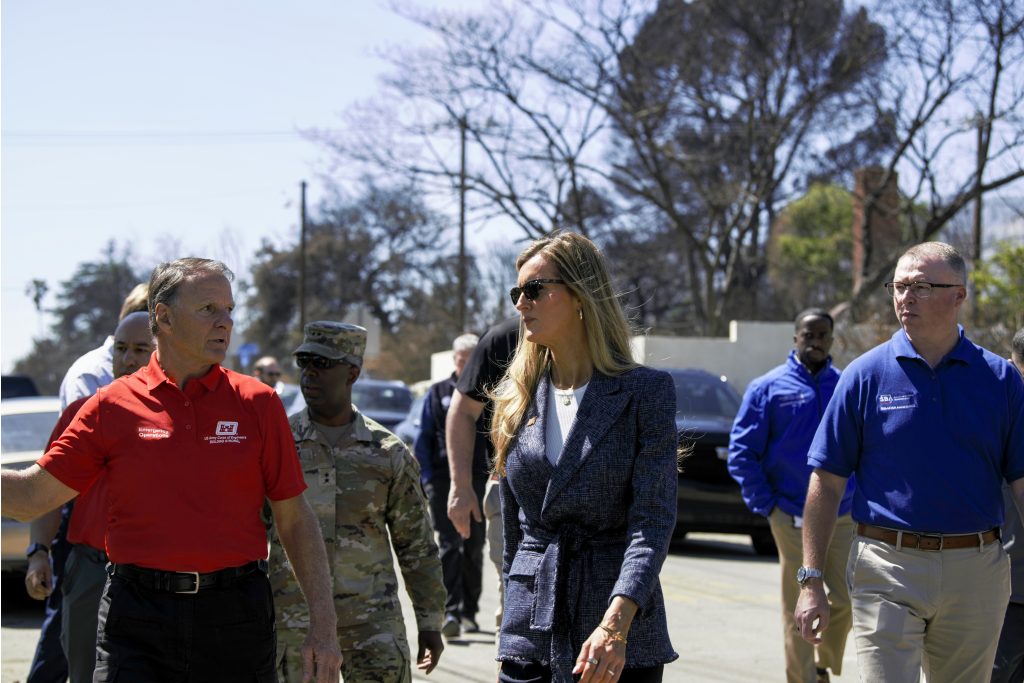 Administrator Loeffler touring a disaster area alongside Associate Administrator Chris Stallings