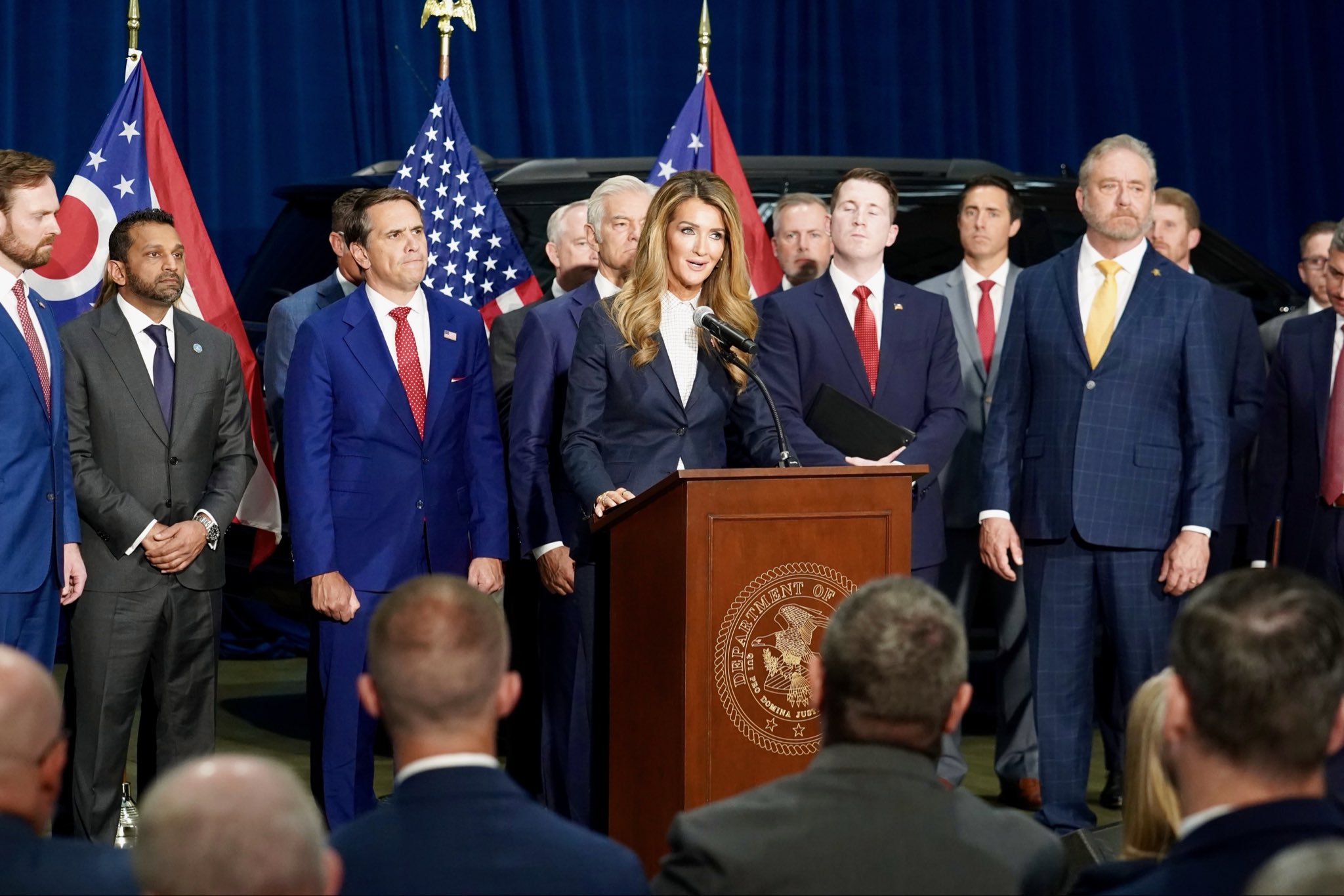 Administrator Loeffler at a podium