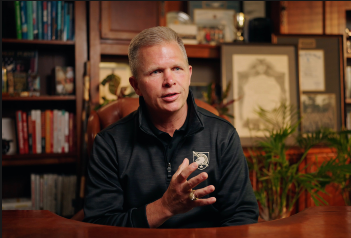 Dean Wegner speaks in an office.